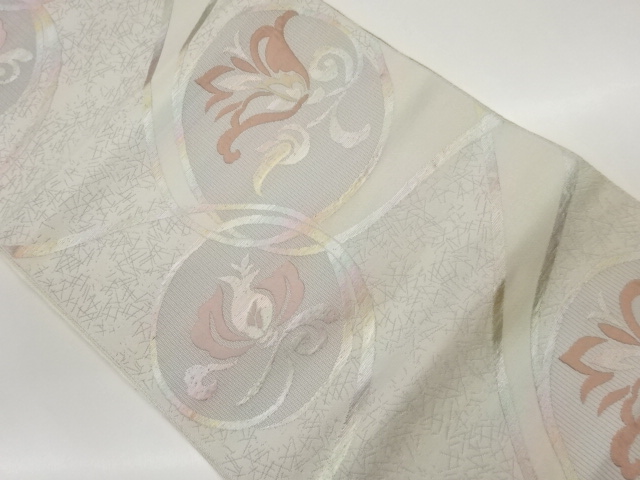 丸文に抽象花唐草模様織出し名古屋帯